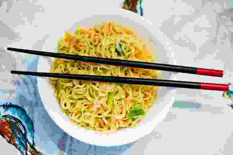 bowl of plain ramen noodles with chopsticks