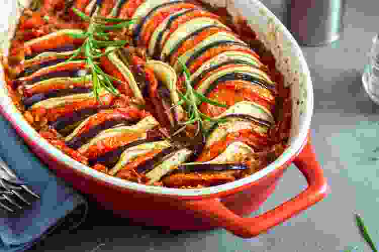 Ratatouille in red casserole dish