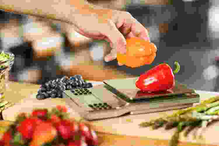 weighing vegetables on a kitchen scale