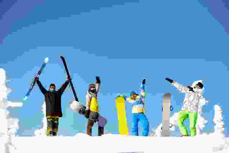 group of snowboarders on the slopes