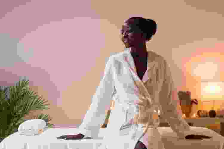 woman relaxing in robe at the spa