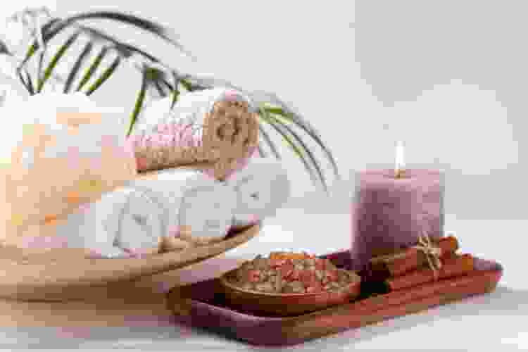 basket of spa items, including soap, bath bombs and candles