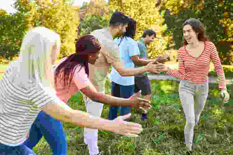 team members high fiving after game