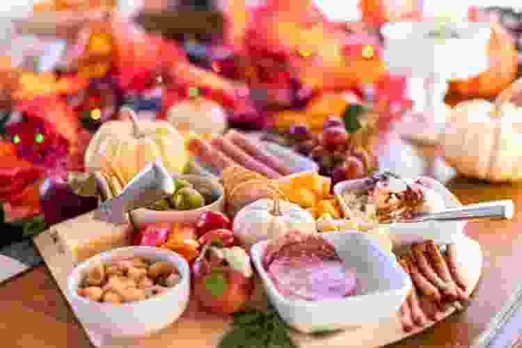 Thanksgiving charcuterie board ideas with leaves and pumpkins