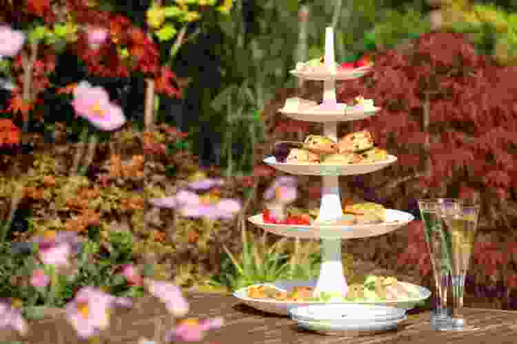 tiered cake stand with desserts for tea party decor