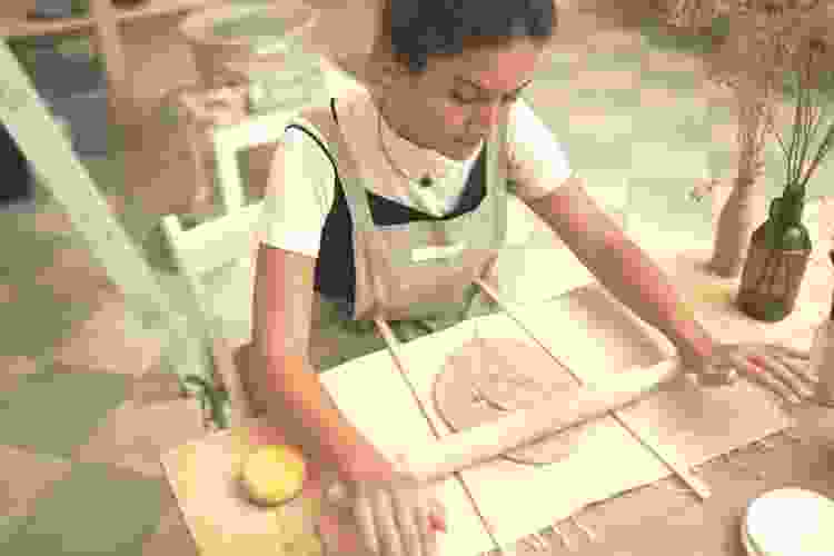 pottery rolling clay with rolling pin