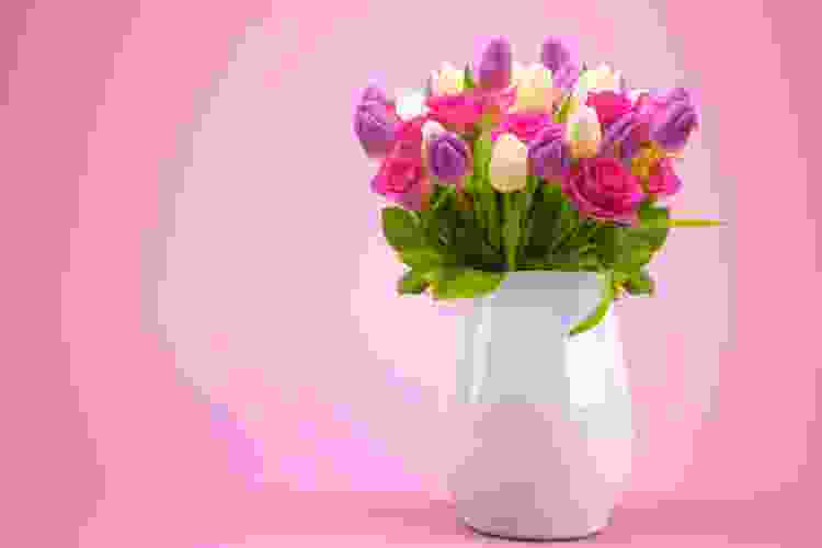 Purple and white tulips and pink roses are a nice valentines flower idea