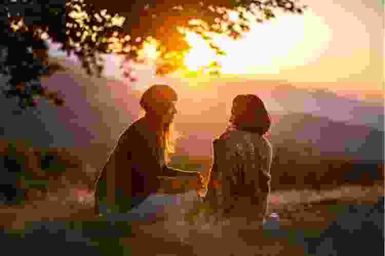 Two women in nature at golden hour