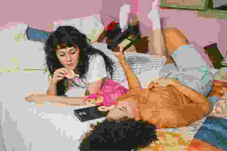 young women watching VHS movies