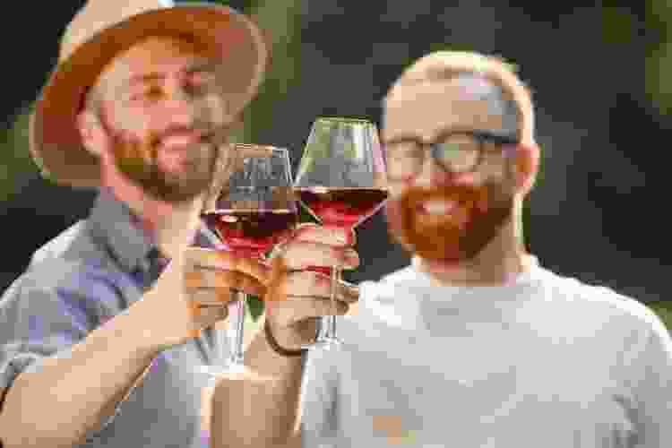 couple drinking wine together at a vineyard