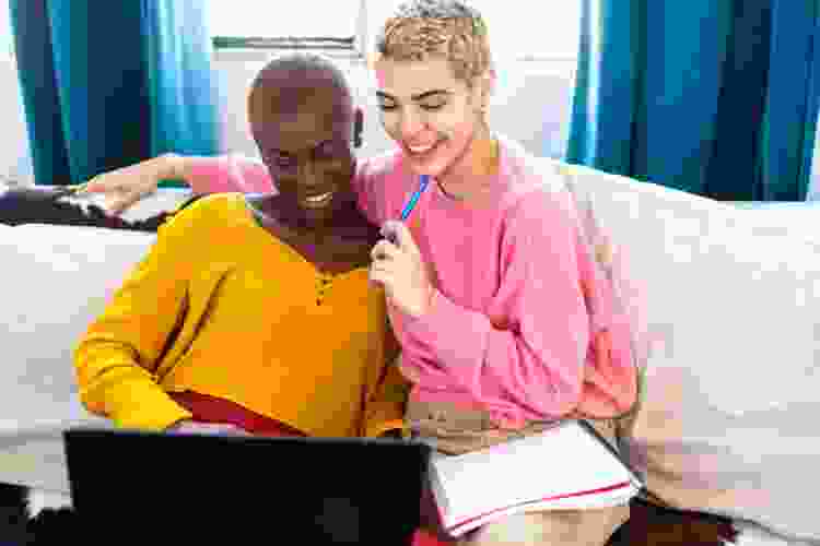 couple playing games on laptop