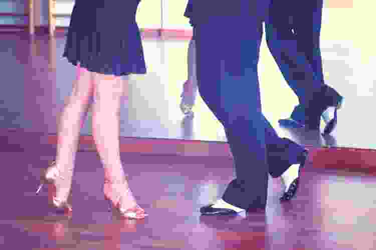 couples feet dancing on dance floor