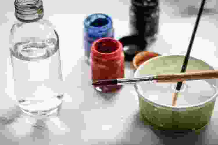 dipping paintbrushes in water