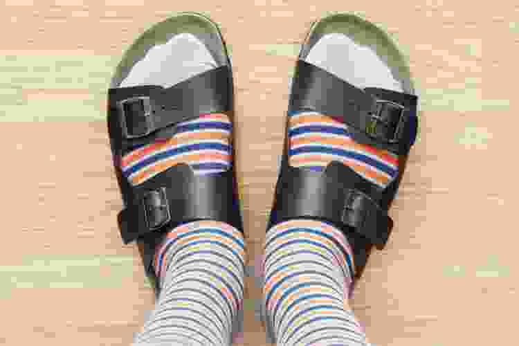 Who is most likely to wear socks with sandals?