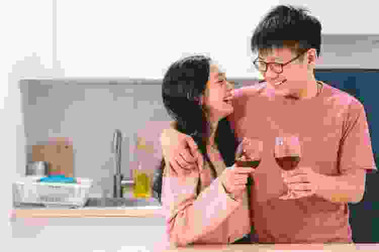 couple drinking wine on couch