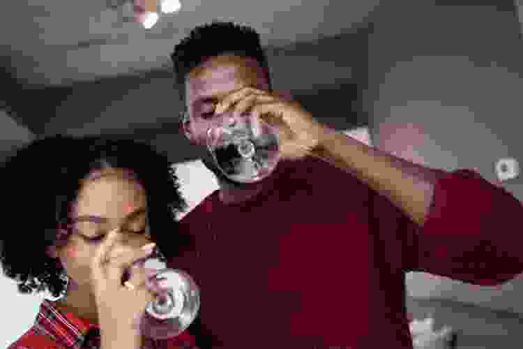 young couple drinking red wine together