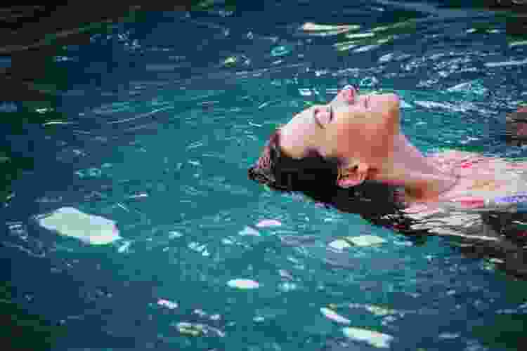 Woman floating in water