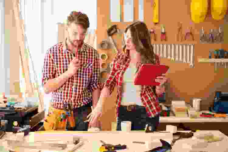 couple building in woodshop together
