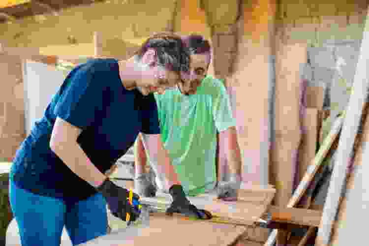 couple building wooden crafts in woodshop