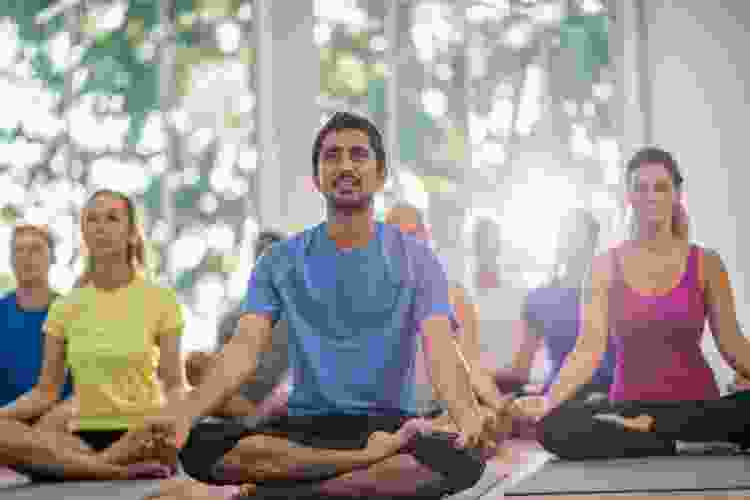 group of adults posing in yoga class