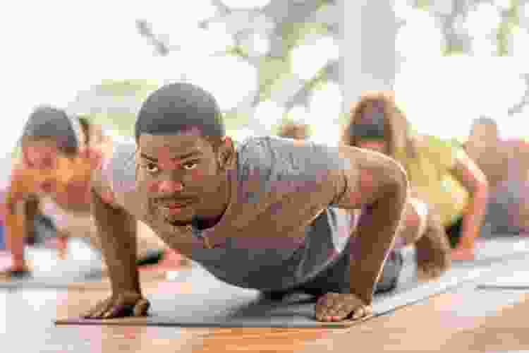 group doing poses in yoga studio