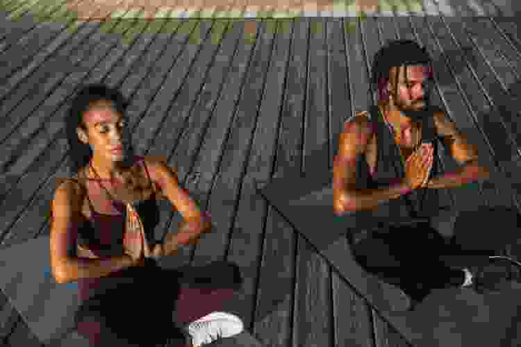 couple doing yoga outside