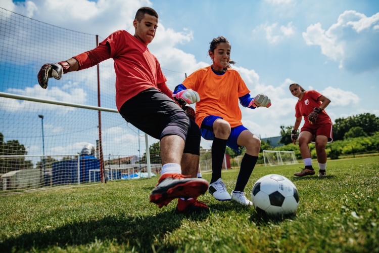 kids playing soccer as after-school activity