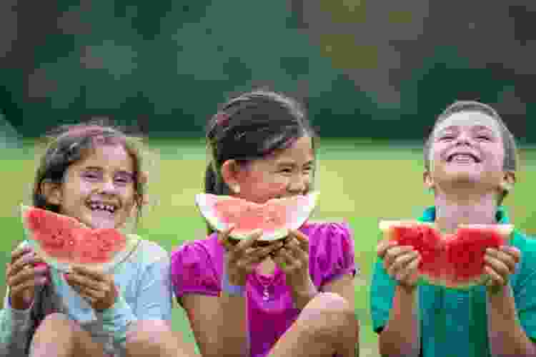 Kids eating watermelon