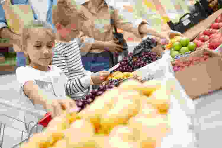 Choosing summer fruit at a farmer's market