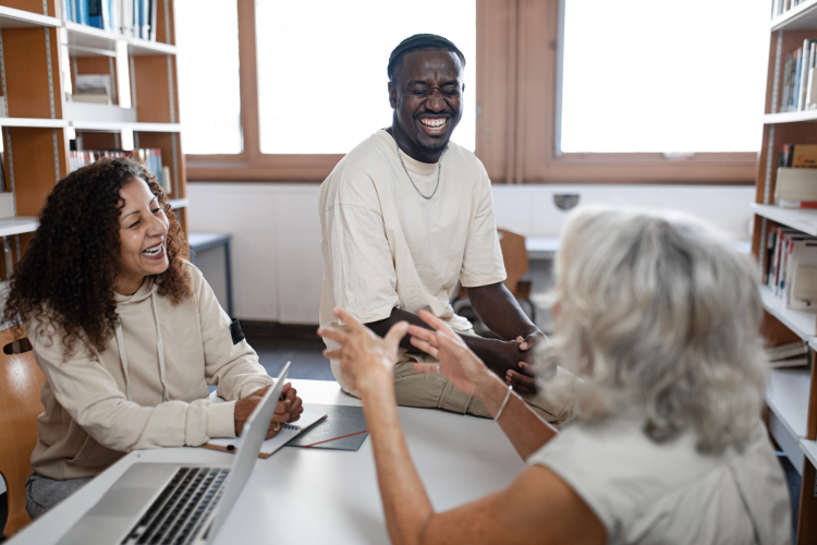 Group of adults laughing at riddle