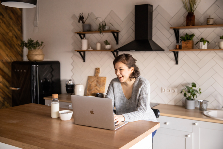 Laptop at kitchen island