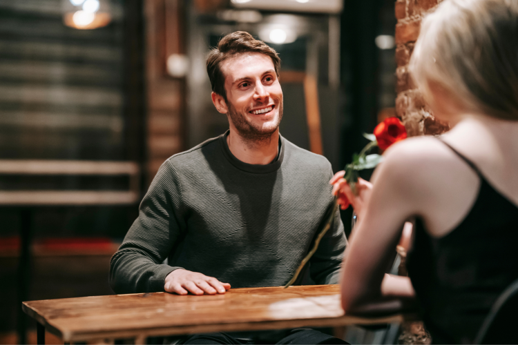 Man talking to a women in a restaurant