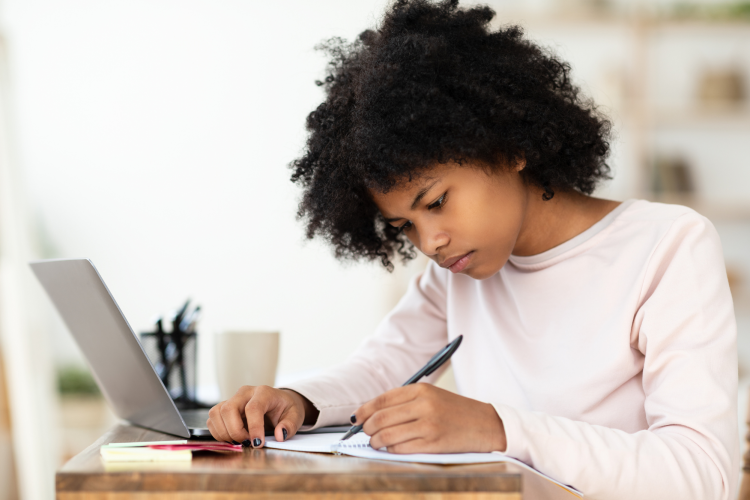 Kid Writing in notebook