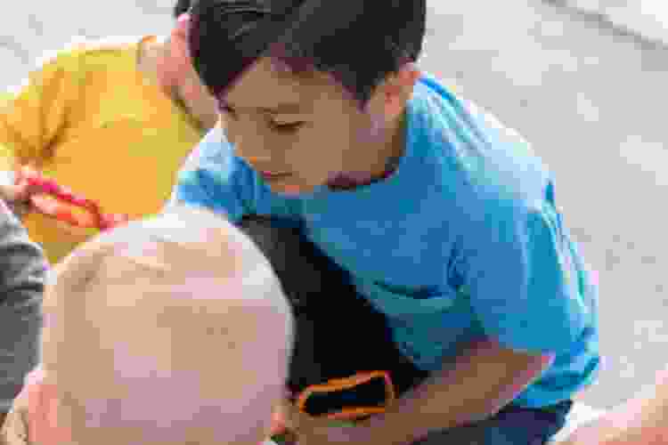 child playing with sensory bin