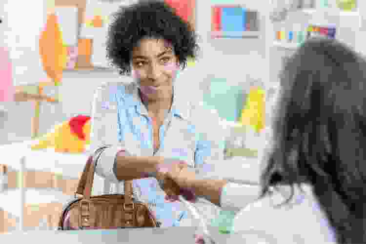 Parent shaking teachers hand