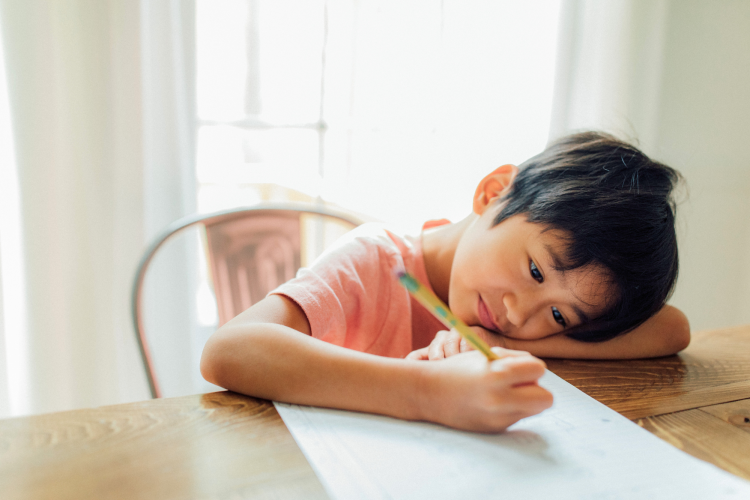 child studying independently