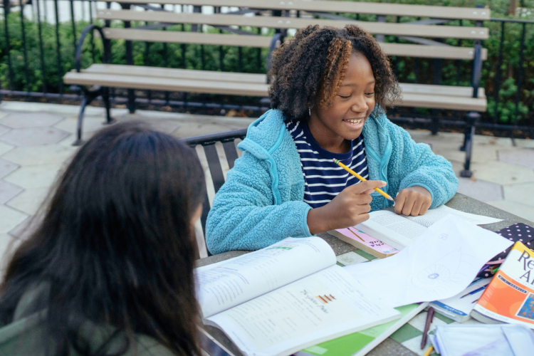 girl smiling while studying