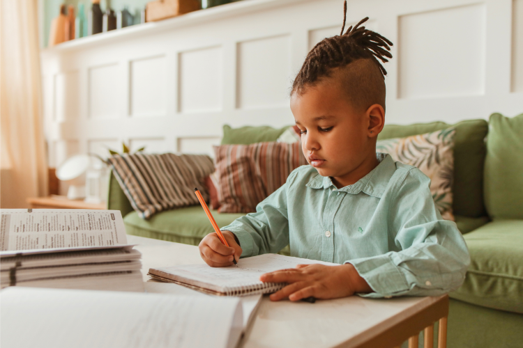 boy studying in the living room