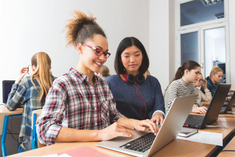 Female Students Using Laptop