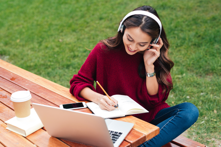 Female Student Studying in Park