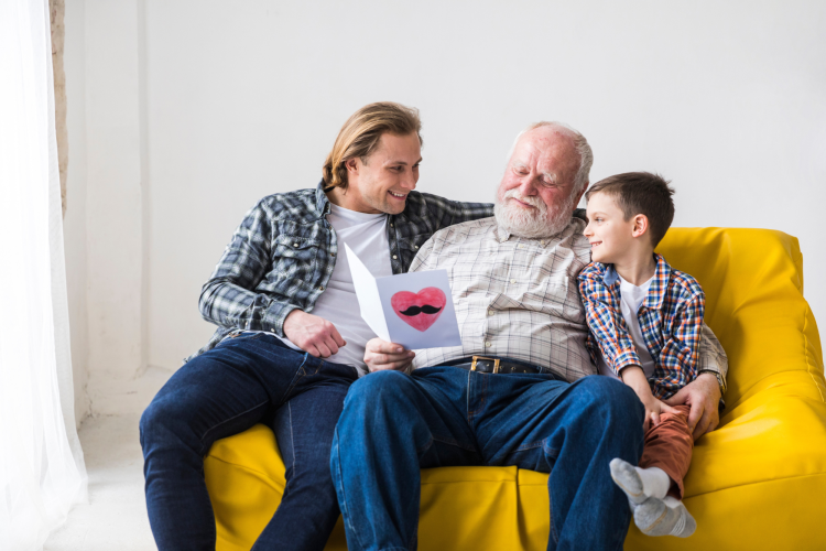 Sons giving Happy Fathers Day Card