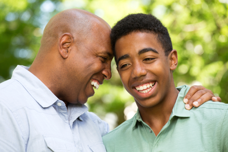 Father hugging Teen Son
