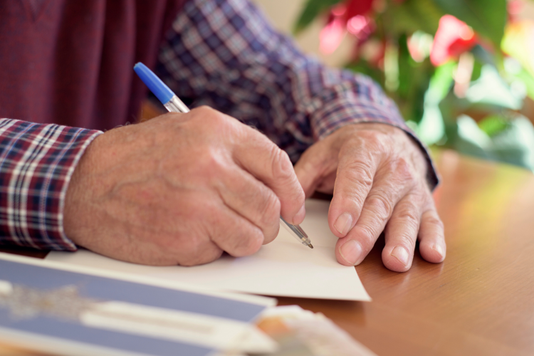 Old Man Writing Card