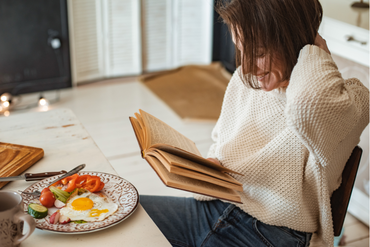 woman reading with breakfast