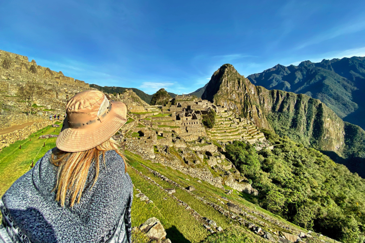 woman standing against machu picchu mountains sky