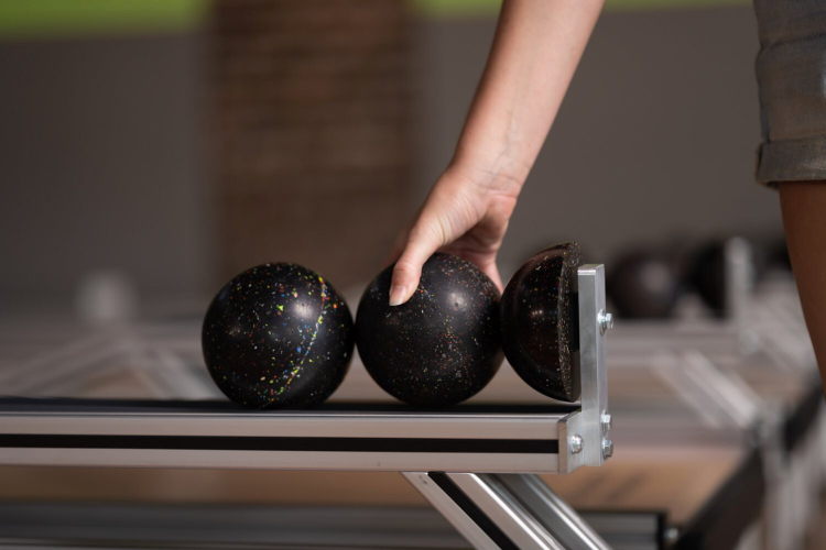 Woman holding ball at Bob & Willie's Wonderbowl
