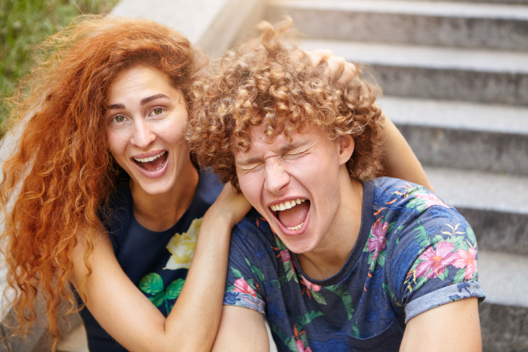 Two people laughing and joking
