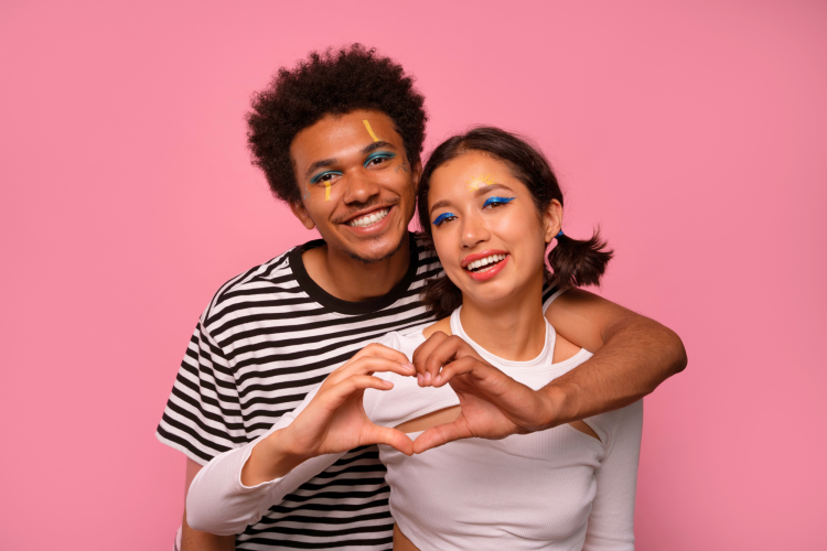 couple making a heart sign