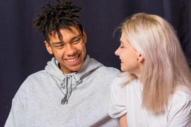 mixed couple teasing and smiling