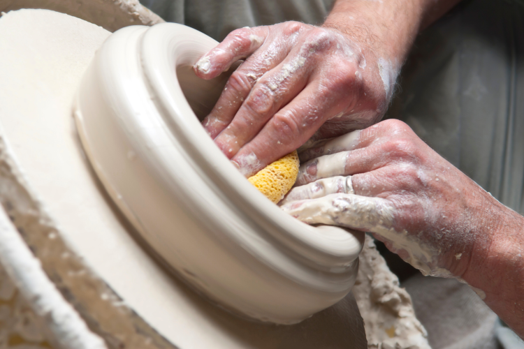 Smoothing Pottery with a sponge